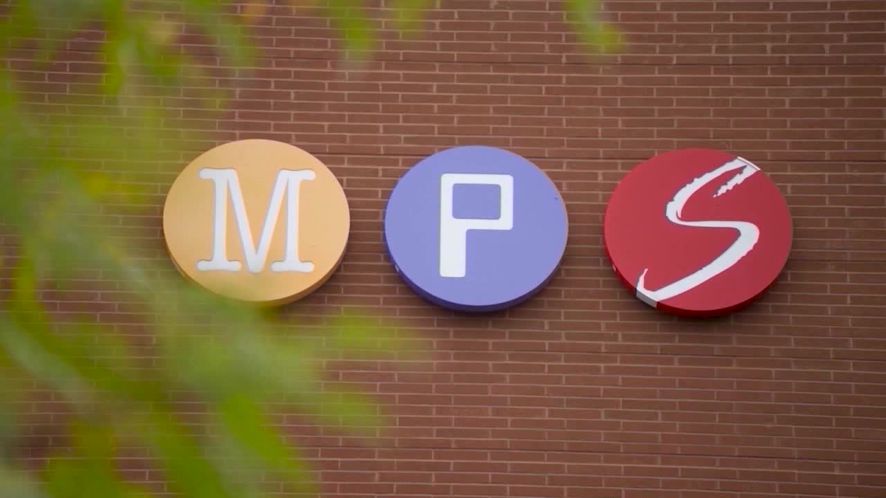 Minneapolis Public Schools building with students walking nearby
